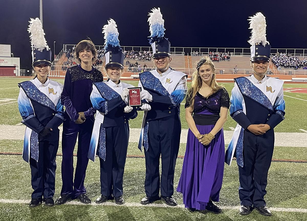 Members of Mars Area High School Marching Band pause for a picture with their first place trophy earned at the Moon Area Marching Band Festival on Oct. 9.