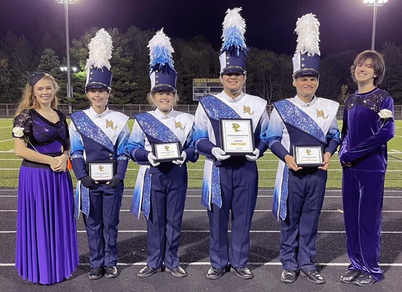 Members of Mars Area High School Marching Band pause for a picture with their first place trophy earned at the Deer Lakes Marching Band Festival on Oct. 16.