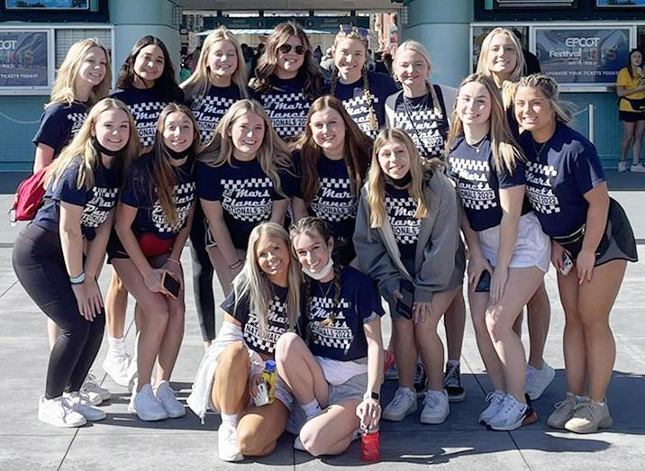 Members of Mars Area High School Competitive Cheer Team gather for a photo outside Hollywood Studios during the team’s trip to the UCA National High School Cheerleading Championship.