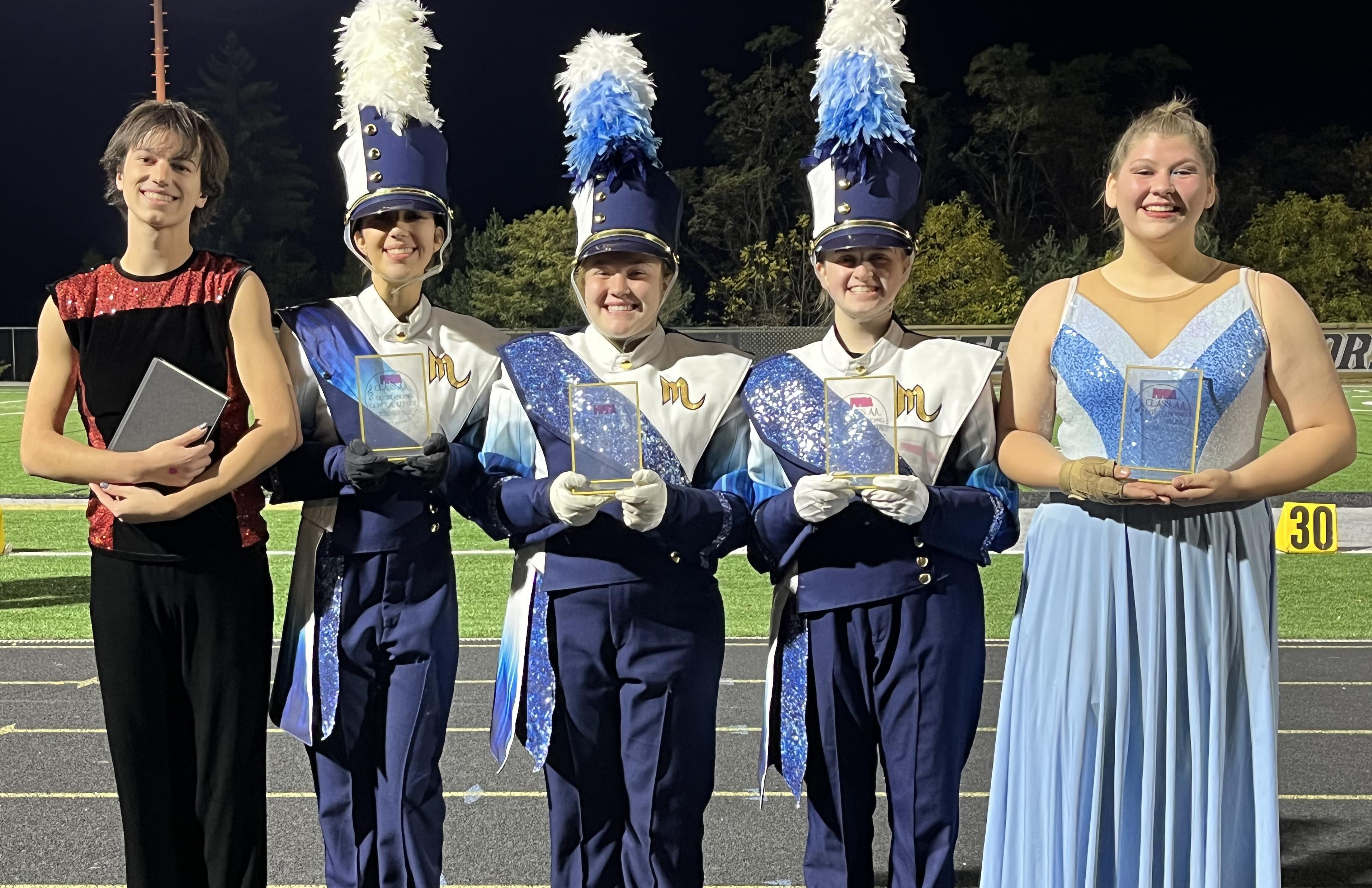 Members of Mars Area High School Marching Band pause for a picture with their first-place trophy earned at the Gateway Marching Band Festival on Oct. 15.