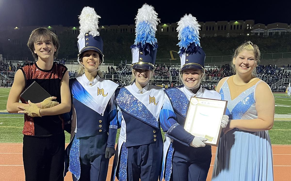 Members of Mars Area High School Marching Band pause for a picture after winning the 2022 PIMBA Class 2A Championship Title.