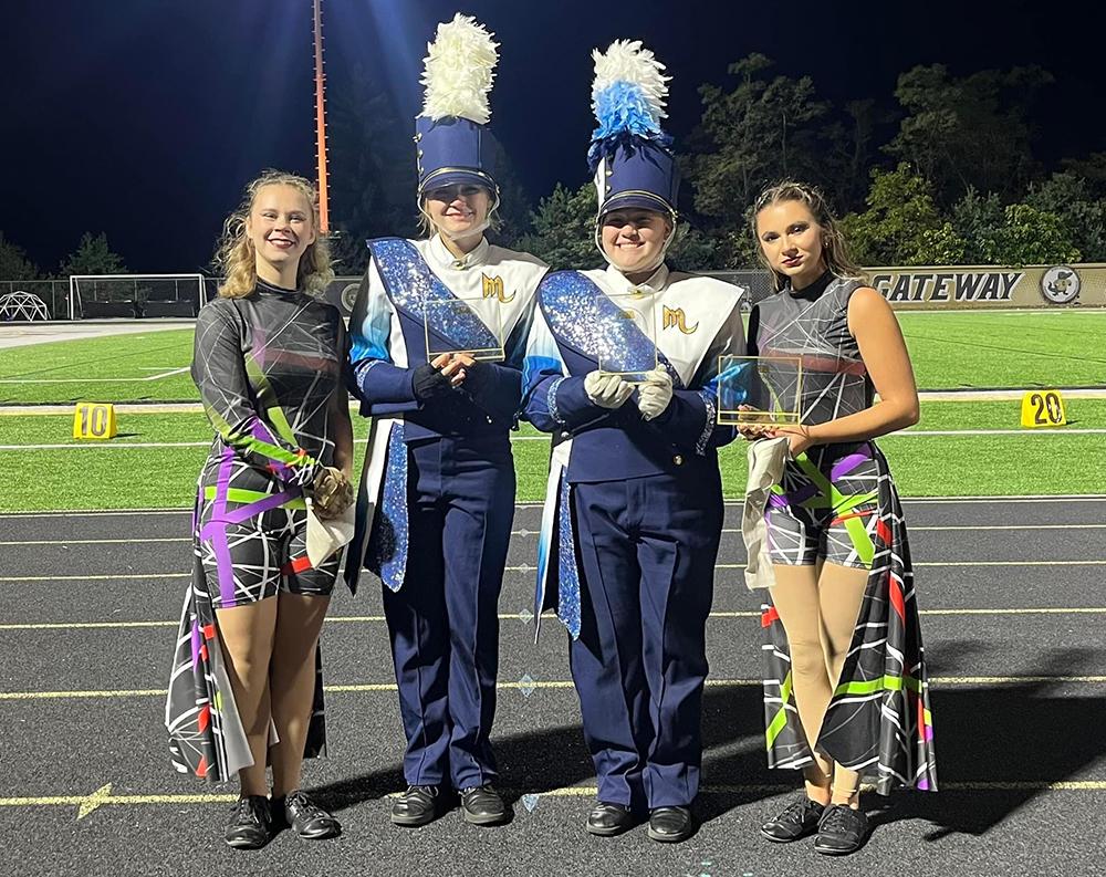 Members of Mars Area High School Marching Band pause for a picture with their first-place trophy earned at the Gateway Contest of Champions, held Oct. 7.