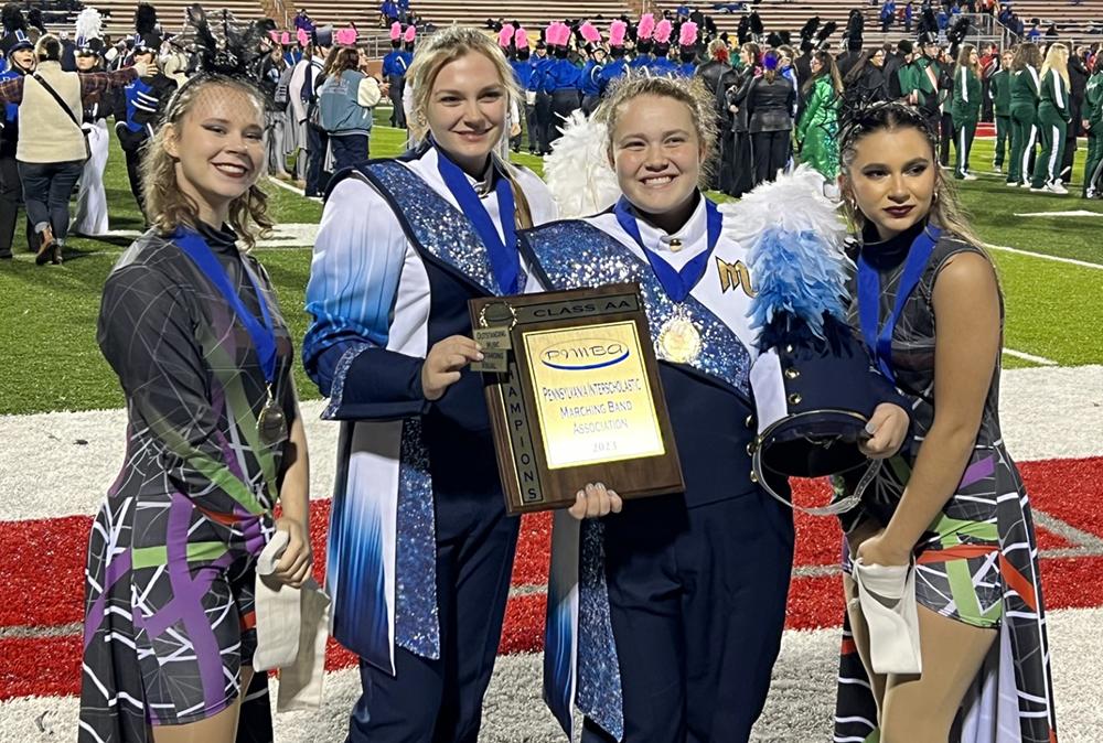 Members of Mars Area High School Marching Band pause for a picture with their first-place trophy earned at the 2023 PIMBA Class 2A Championships on Oct. 28.